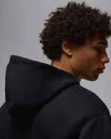 Buzo hoodie negro de la marca Nike Jordan, con logo Jumpman bordado en blanco en el pecho y bolsillo tipo canguro.