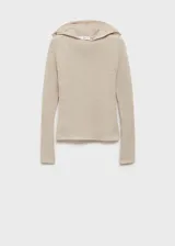 Jersey de punto acanalado en color beige, con diseño de manga larga y capucha integrada. Presenta un corte ajustado y acabado con bordes sin costuras visibles.