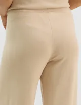 Pantalón tejido de corte recto y diseño fluido, color amarillo, con cintura ancha elastizada.