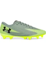 Championes de fútbol Under Armour modelo Shadow Select 3 FG, con diseño en tonos gris y amarillo neón. Presentan una parte superior de piel sintética suave, cierre con cordones, plantilla de EVA para mayor comodidad y suela de TPU con tacos cónicos optimizados para superficies naturales firmes.