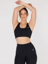 Top deportivo negro de medio impacto con espalda estilo nadadora y sujetador integrado con almohadillas removibles.