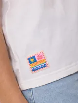 Remera manga corta color lila con estampado en el frente con la frase "The Sun Rusty". Corte holgado.