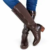 Bota de caña alta negra, realizada en napa Milano con pantorrilla de lycra italiana y detalles en crocco al tono.
