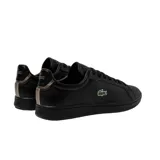 Championes urbanos de cuero negro con logo de cocodrilo verde bordado en el lateral.