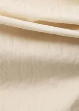 Blusa sin mangas de diseño recto con cuello asimétrico y drapeado, confeccionada en una mezcla de algodón y poliamida.