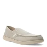 Zapatos tipo slip-on de tela color beige, con diseño de bordes deshilachados y suela de goma al tono.
