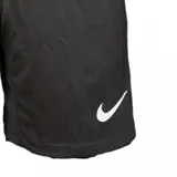 Short de fútbol Nike Dri-FIT titular de la selección uruguaya, color negro, con escudo de la AUF bordado con cuatro estrellas y logo Nike Swoosh en blanco.