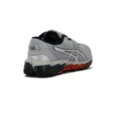 Championes Asics Gel-Quantum 360 Direction, de color gris con detalles plateados, negros y naranjas en la suela. Diseño deportivo con capellada de malla transpirable y tecnología de amortiguación visible en la suela.