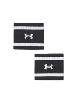 Par de muñequeras deportivas Under Armour, confeccionadas en tejido de rizo ligero, elástico y absorbente. Presentan un diseño a rayas horizontales en color negro y blanco con el logo de la marca bordado en el centro.