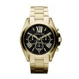 Reloj Michael Kors modelo Bradshaw, con caja y pulsera de acero inoxidable dorado, esfera negra con números romanos y tres subesferas de cronógrafo.