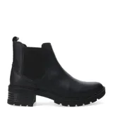 Botas tipo Chelsea de cuero color marrón, con paneles elásticos laterales y suela dentada de goma con tacón bajo.