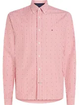 Camisa de manga larga Tommy Hilfiger a rayas verticales rojas y blancas con pequeños lunares negros. Tiene cuello abotonado, cierre con botones y logo bordado en el pecho.