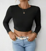 Top negro de lycra morley, manga larga, con espalda descubierta y nudo en la parte inferior.