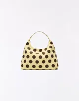 Cartera tipo tote bag de lona color beige con estampado de lunares marrones, con asa de hombro integrada.