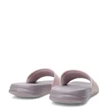 Sandalias tipo ojota Puma modelo Popcat 20, con base y suela en color lila y banda superior en color rosado con el logo de la marca en relieve.