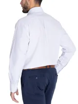 Camisa de manga larga a rayas verticales color celeste y beige, con cuello abotonado, bolsillo en el pecho con logo bordado y calce holgado.