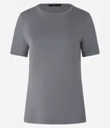 Blusa básica color mostaza, con escote redondo y manga corta.