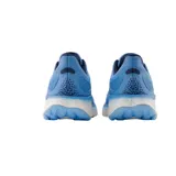 Championes de running New Balance Fresh Foam X 1080v12, color celeste con detalles en azul y blanco.