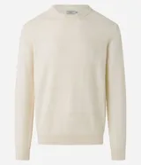 Buzo azul marino de algodón texturizado, con cuello redondo y mangas largas con puños ajustados.