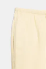Pantalón tipo palazzo confeccionado en lino, con cintura elástica ajustable mediante cordones y diseño de pierna ancha con ruedo ancho.