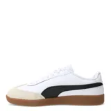 Championes Puma 9T W, color negro con detalles en blanco y suela color caramelo.