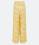Pantalón pantalona de lino con estampado de cocoteros, cintura alta y cierre lateral invisible.
