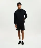 Campera deportiva con capucha y cierre de cremallera frontal, de color marrón. Cuenta con bolsillos laterales con cierre y puños y cintura elastizados.