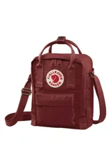 Bandolera Fjallraven Kanken Sling color burdeos, confeccionada en Vinylon F, con logo reflectivo, correa ajustable, bolsillo frontal con cierre, bolsillo trasero con cierre y compartimento principal con bolsillo interno.