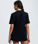 Remera de algodón color negro con estampado frontal de Britney Spears y tipografía holográfica. Presenta cuello redondo y mangas cortas con un corte regular.