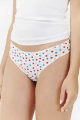 Colaless de algodón blanco con estampado de lunares rojos, azules y celestes. Tiene un pequeño moño blanco en la parte delantera y bordes festoneados.