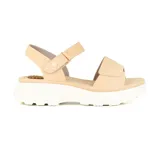 Sandalias color beige con plataforma blanca, ajuste con velcro en el tobillo y detalle de perforaciones en la tira delantera.