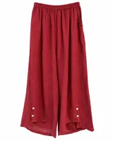 Pantalon ancho color bordo de lino con cintura elástica fruncida y detalle de botones en los tobillos.