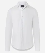 Camisa de hombre, corte slim, color blanco, confeccionada en algodón y poliéster con tecnología Easy Care que ofrece elasticidad y secado rápido. Presenta cuello inglés y manga larga con puño abotonado.