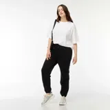 Pantalón de jogging negro con cintura elástica ajustable con cordón y puños elásticos.