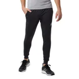 Pantalón de jogging negro con logo de New Balance en el muslo izquierdo.
