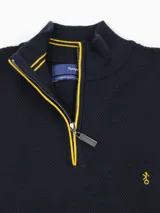 Buzo de hilo punto piqué azul marino con medio cierre frontal y detalles en amarillo en el cuello y la cremallera, y pequeño bordado en el pecho.