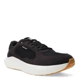 Championes deportivos Under Armour modelo Versurge, color gris oscuro con detalles en negro. Presentan una entresuela blanca de amortiguación y suela de goma color caramelo. Diseño con cordones y paneles de malla transpirable.