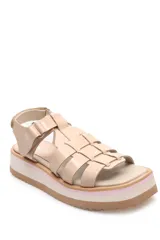 Sandalias negras con tiras anchas, plataforma blanca y detalles en verde.