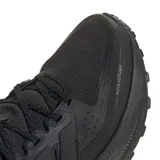 Championes de running Adidas modelo Ultrarun 5 TR, color negro. Presentan un diseño técnico con malla superior repelente al agua, mediasuela con tecnología Bounce 2.0 para mayor amortiguación y suela de goma Adiwear con taqueado para un agarre óptimo en diversas superficies.