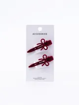 Set de dos pinzas para el pelo tipo clip, color negro, con detalle de lazo decorativo en la parte superior.