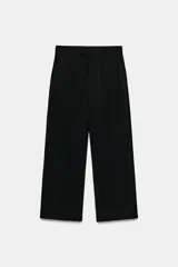 Pantalón de lana negro de tiro medio con trabillas en la cintura, bolsillos laterales ocultos y pierna ancha.