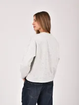 Buzo de cuello redondo y manga larga en color gris melange, con estampa frontal gráfica que incluye la palabra Oxford, la silueta de un perro salchicha y texto decorativo.