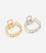 Kit de dos pinzas para el pelo de metal, con diseño calado en forma de cabeza de gato, una en tono dorado y otra plateado.