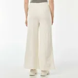 Pantalón de chándal ancho color beige con cordón ajustable en la cintura.