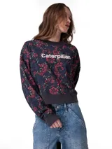 Buzo Caterpillar de cuello redondo en suave tejido french terry, de calce relajado y mangas largas. Presenta estampado floral completo en tonos azules y rojos, con el logo de la marca en el centro del frente y detalles de punto acanalado en puños, cuello y dobladillo.