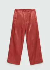 Pantalon de tiro alto con diseño recto y corte crop, confeccionado en tejido satinado fluido con cierre de cremallera y botón.