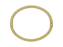 Pulsera esclava rígida compuesta por pequeñas esferas metálicas unidas, con cierre de broche integrado.