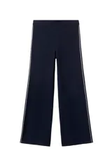 Pantalón de punto azul marino de corte recto y tiro alto, con ribete blanco en los laterales.