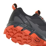 Championes Adidas Terrex Rockadia M de hombre, color negro con detalles en gris y suela y cordones en naranja. Diseñados para trail running y actividades al aire libre.