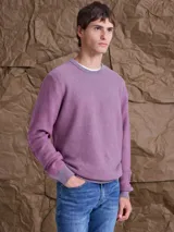 Sweater de tejido de punto con cuello redondo, mangas largas y puños acanalados.